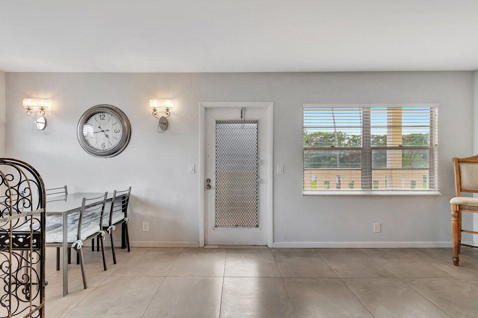 150 Dorset D, Unit 150 Boca Raton, FL 33434 - Photo 9 of 72 a view of a livingroom with furniture and a window