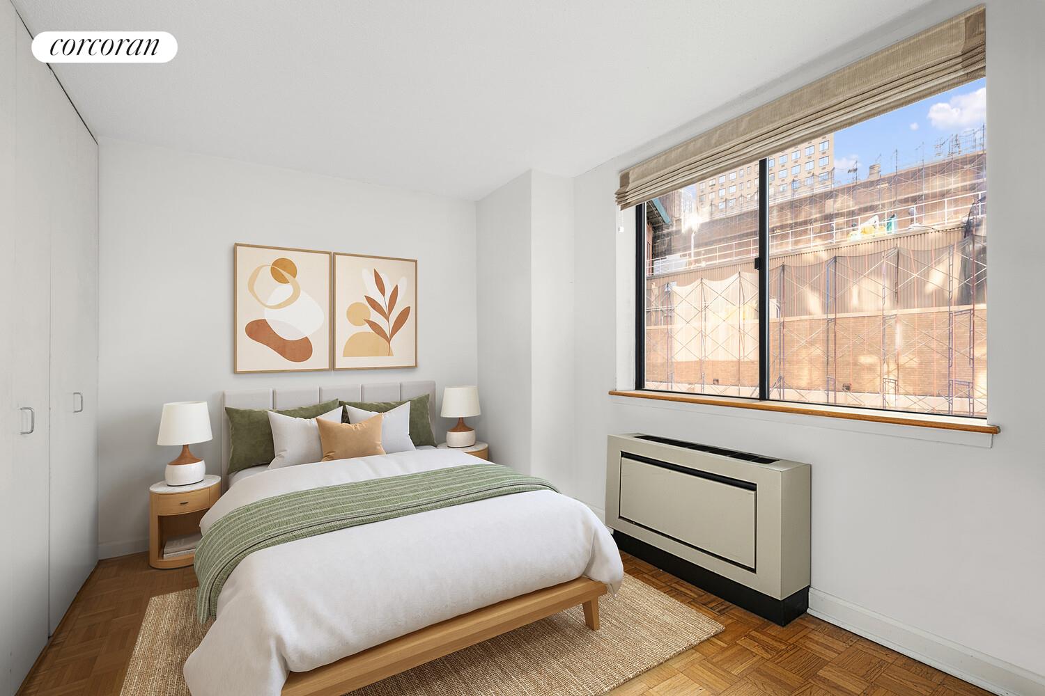 45 West 67th Street, Unit 8E Manhattan, NY 10023 - Photo 2 of 6 a bedroom with a bed and a window