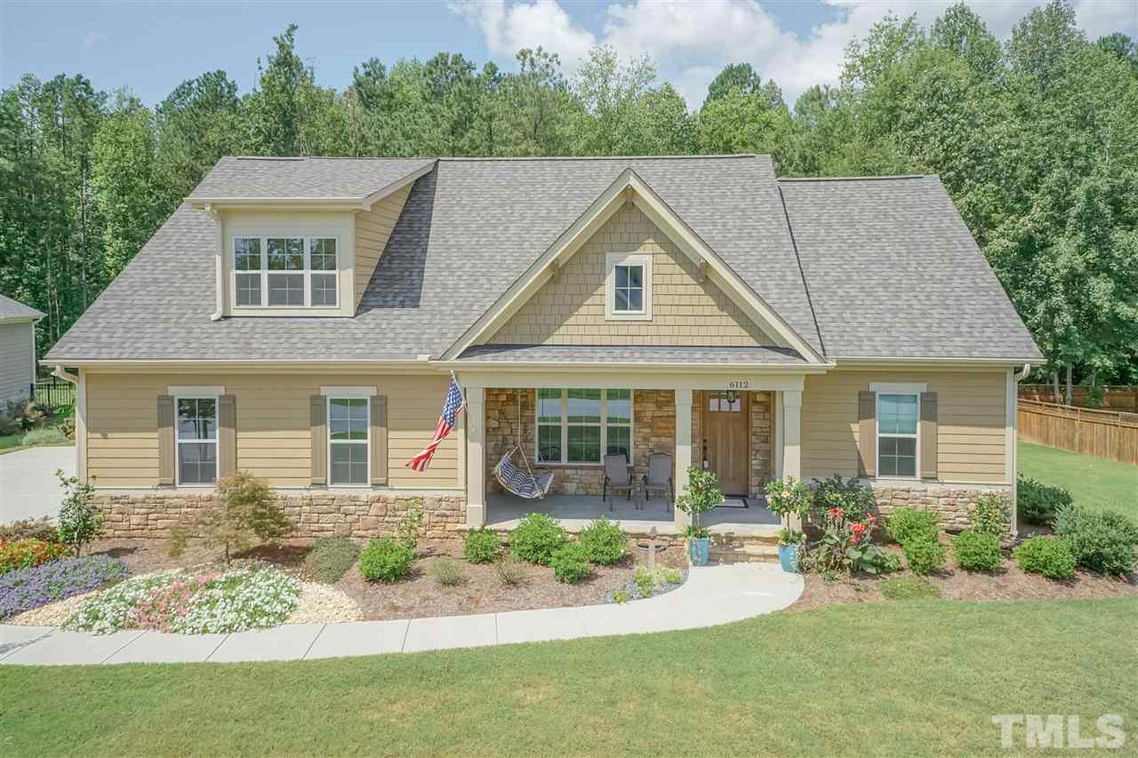 6112 Spring Branch Circle Raleigh, NC 27603 - Photo 1 of 30 front view of a house with a yard
