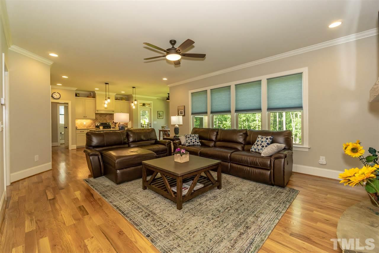 6112 Spring Branch Circle Raleigh, NC 27603 - Photo 13 of 30 a living room with furniture and a wooden floor