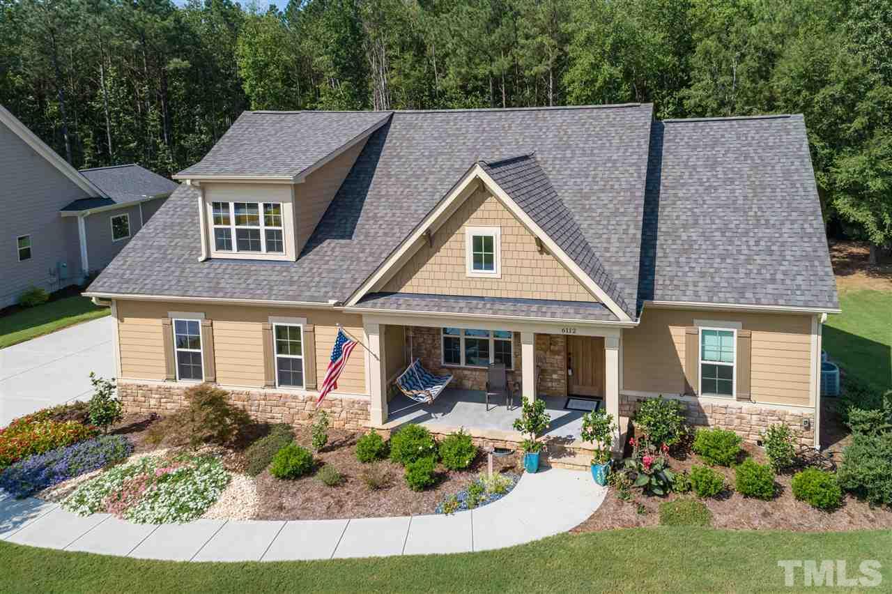 6112 Spring Branch Circle Raleigh, NC 27603 - Photo 3 of 30 front view of a house with a yard