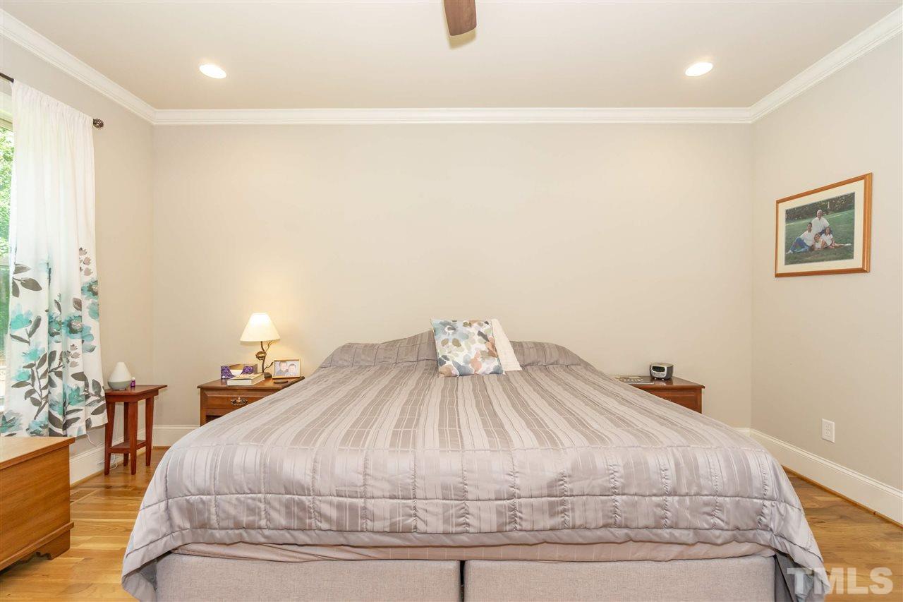 6112 Spring Branch Circle Raleigh, NC 27603 - Photo 22 of 30 a bedroom with a bed and a lamp