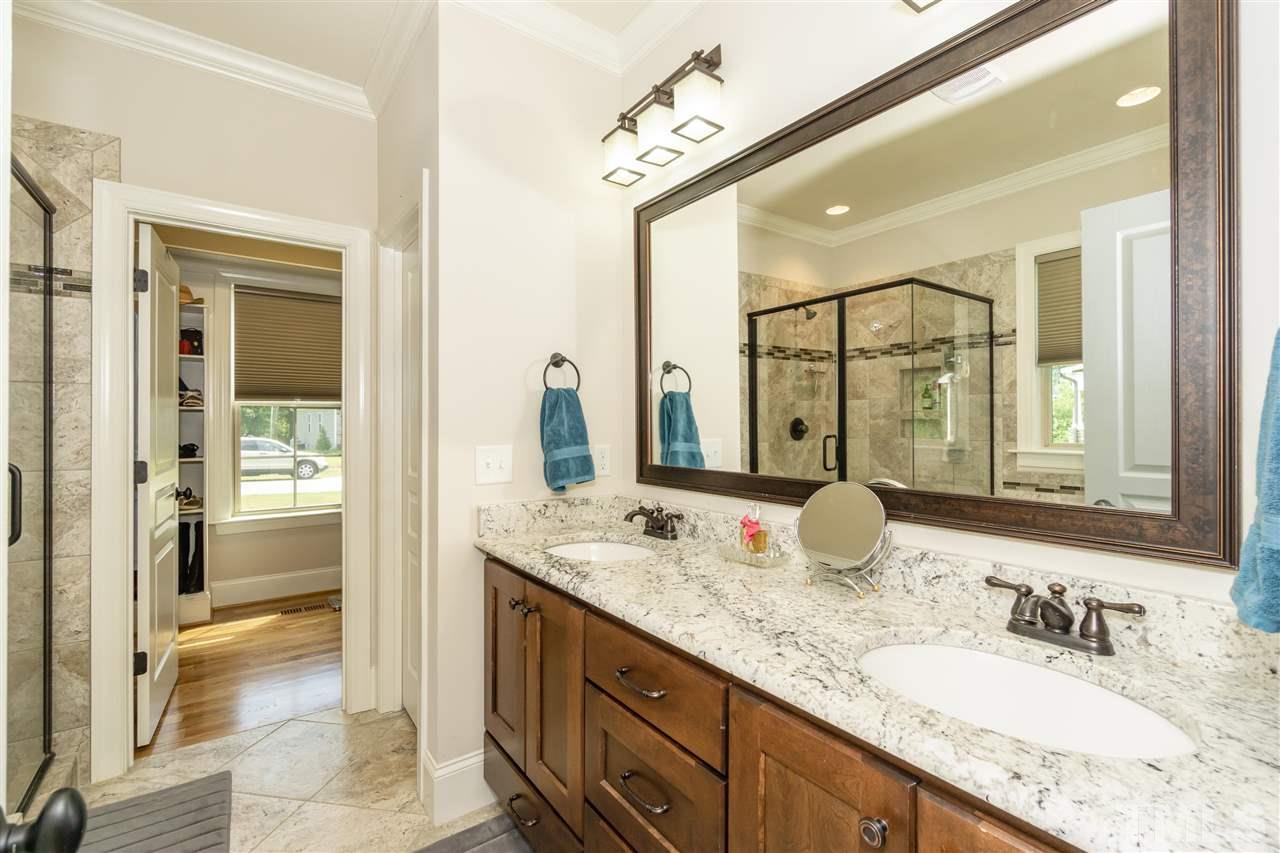 6112 Spring Branch Circle Raleigh, NC 27603 - Photo 24 of 30 a bathroom with a granite countertop sink mirror and double