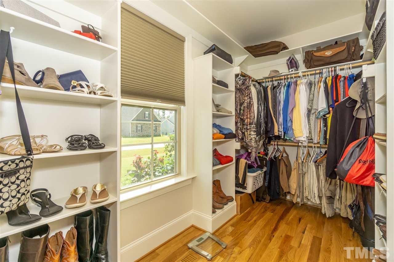 6112 Spring Branch Circle Raleigh, NC 27603 - Photo 26 of 30 a view of walk in closet with clothes and shoes