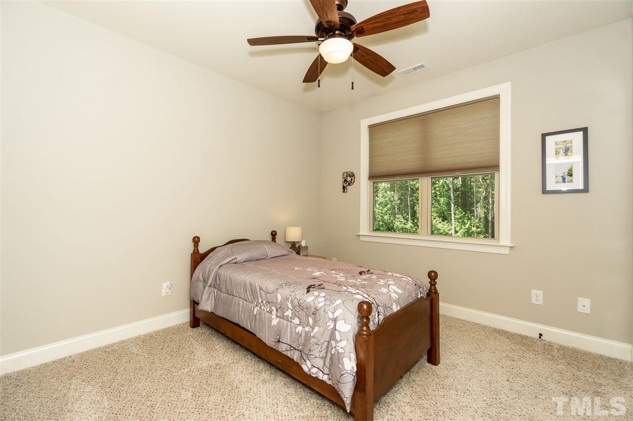 6112 Spring Branch Circle Raleigh, NC 27603 - Photo 29 of 30 a bedroom with a bed and a window
