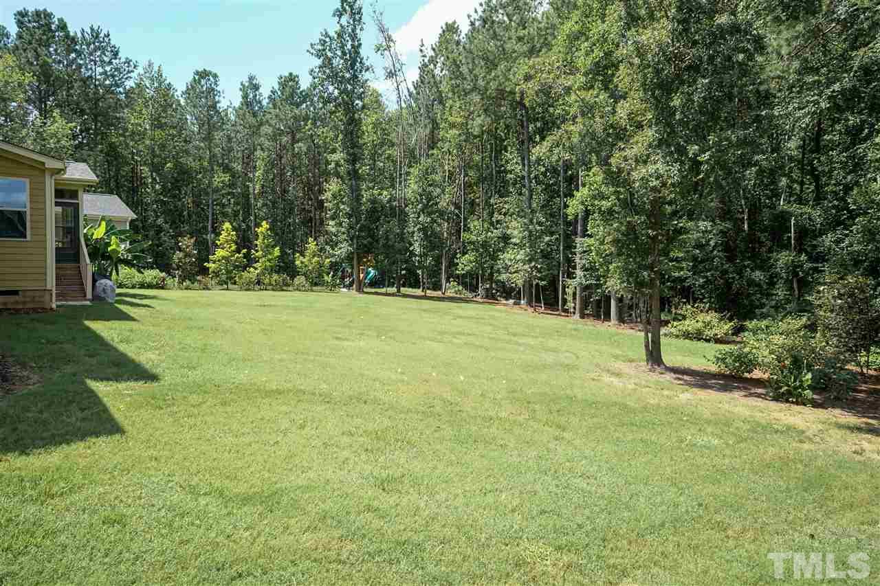 6112 Spring Branch Circle Raleigh, NC 27603 - Photo 5 of 30 a view of a trees with a yard