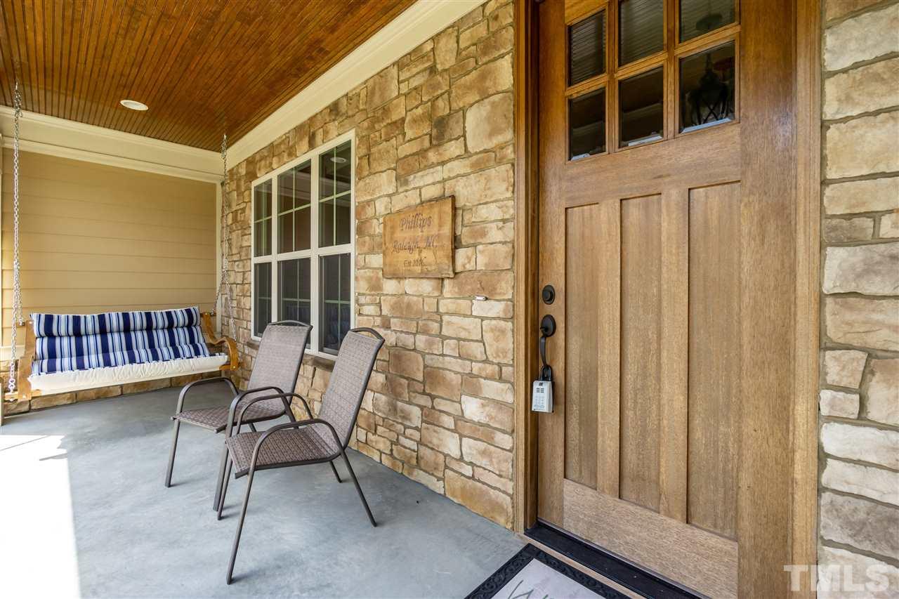6112 Spring Branch Circle Raleigh, NC 27603 - Photo 9 of 30 a balcony with table and chairs