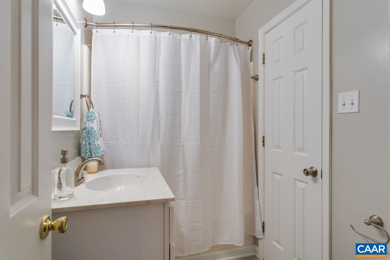 1006 Ridgeley Court Charlottesville, VA 22901 - Photo 11 of 25 a bathroom with a sink and mirror