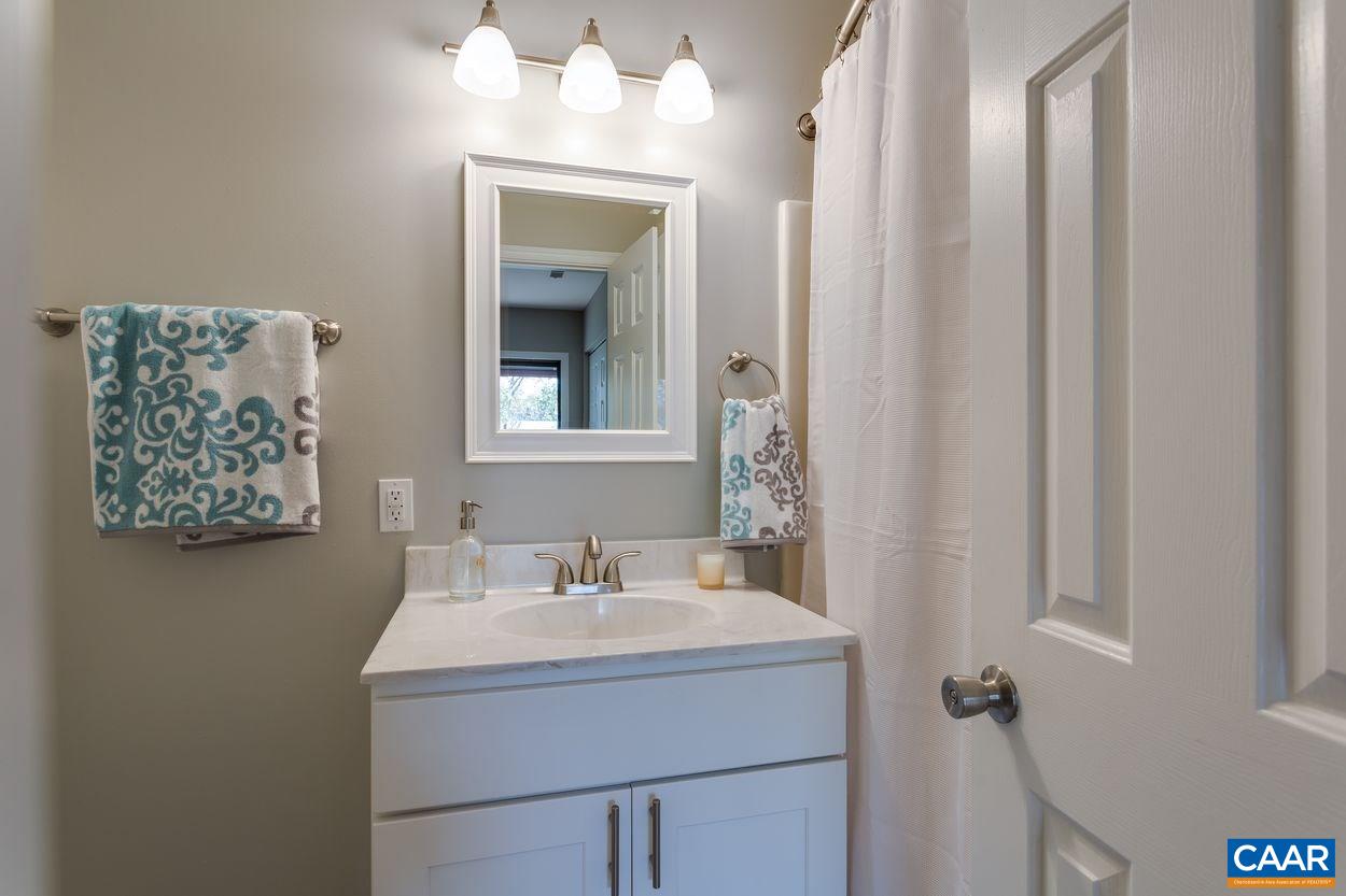 1006 Ridgeley Court Charlottesville, VA 22901 - Photo 12 of 25 a bathroom with a sink and a mirror