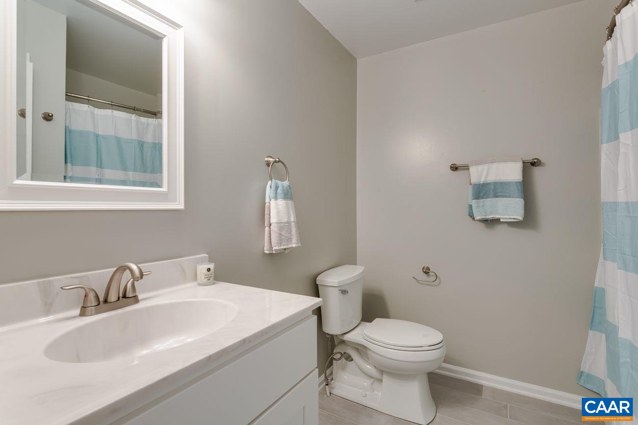 1006 Ridgeley Court Charlottesville, VA 22901 - Photo 17 of 25 a bathroom with a sink toilet and a mirror