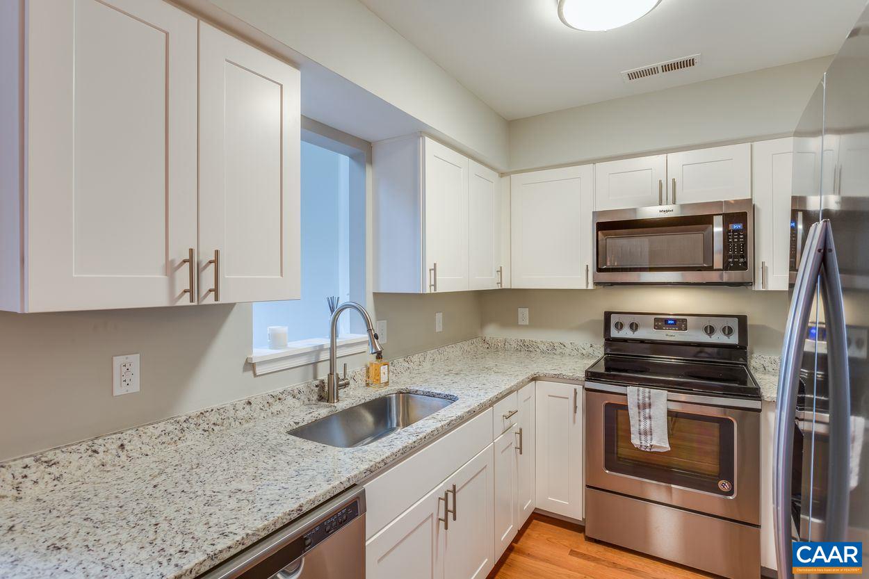 1006 Ridgeley Court Charlottesville, VA 22901 - Photo 5 of 25 a kitchen with granite countertop a sink and stainless steel appliances