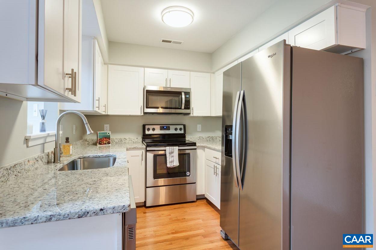 1006 Ridgeley Court Charlottesville, VA 22901 - Photo 7 of 25 a kitchen with stainless steel appliances granite countertop a refrigerator a stove and a sink