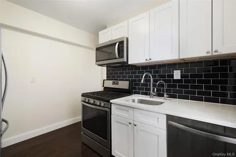 a kitchen with a stove and a microwave