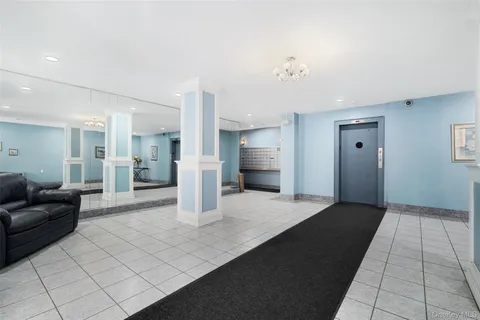 a large white kitchen with a refrigerator a stove and a sink