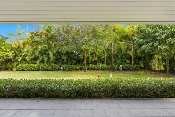 a view of a garden with an outdoor space