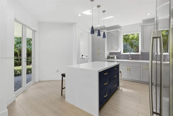 a bathroom with a double vanity sink a mirror and a bathtub