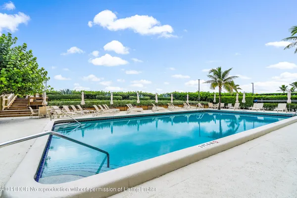 a view of swimming pool from a balcony
