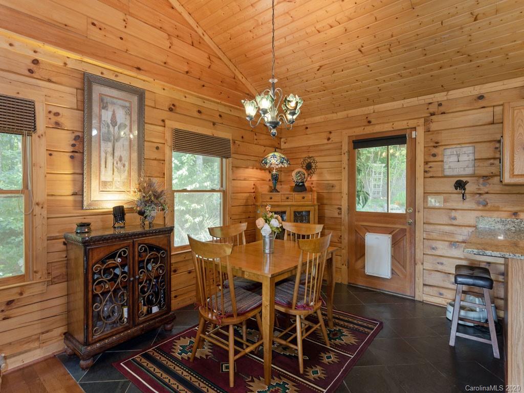 475 Indian Ridge Trail Hendersonville, NC 28739 - Photo 12 of 34 a view of a dining room with furniture window and outside view