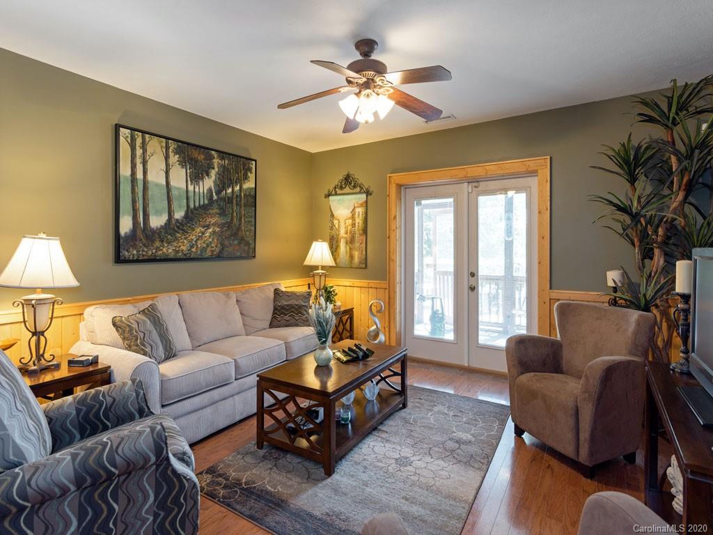 475 Indian Ridge Trail Hendersonville, NC 28739 - Photo 22 of 34 a living room with furniture and a large window