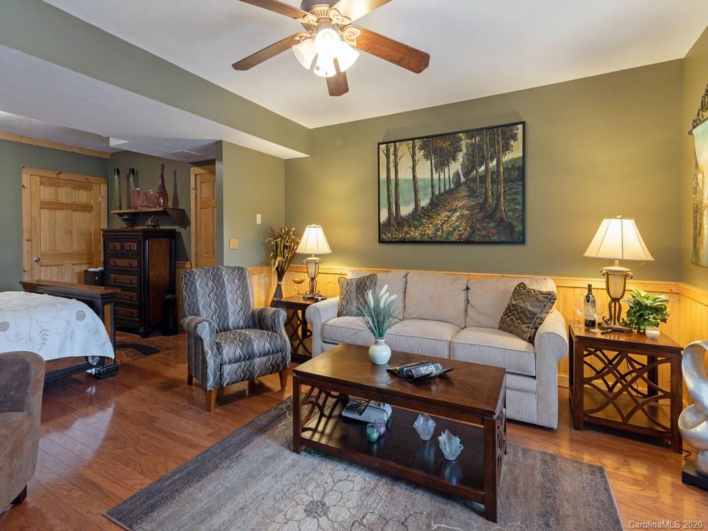 475 Indian Ridge Trail Hendersonville, NC 28739 - Photo 23 of 34 a living room with furniture and a lamp