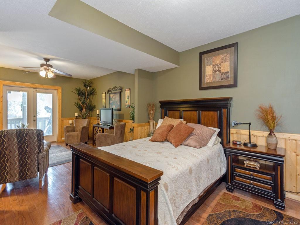 475 Indian Ridge Trail Hendersonville, NC 28739 - Photo 24 of 34 a bed room with bed and a couch