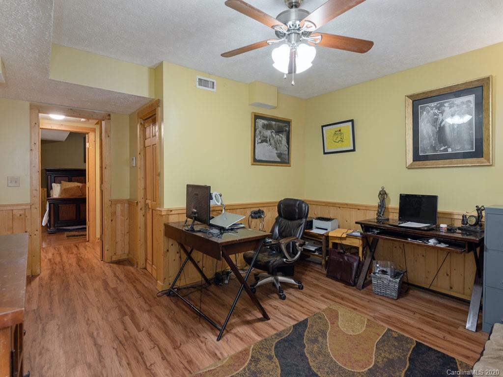 475 Indian Ridge Trail Hendersonville, NC 28739 - Photo 26 of 34 a view of a workspace with wooden floor and a workspace
