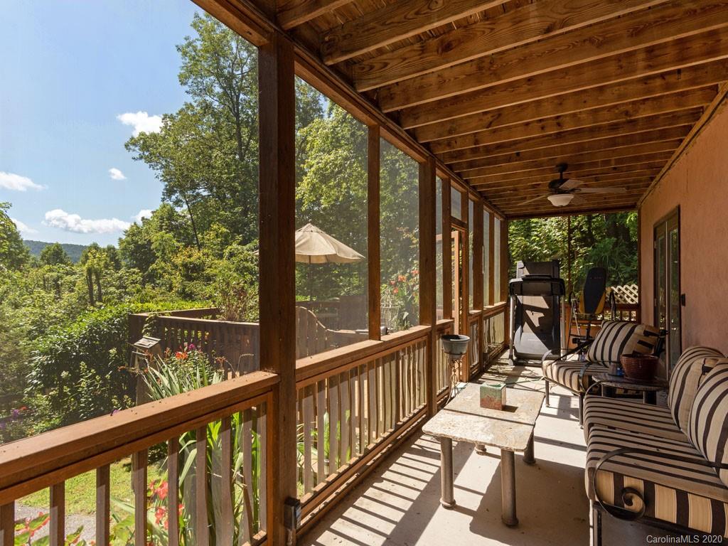 475 Indian Ridge Trail Hendersonville, NC 28739 - Photo 27 of 34 a view of balcony with chairs and wooden fence