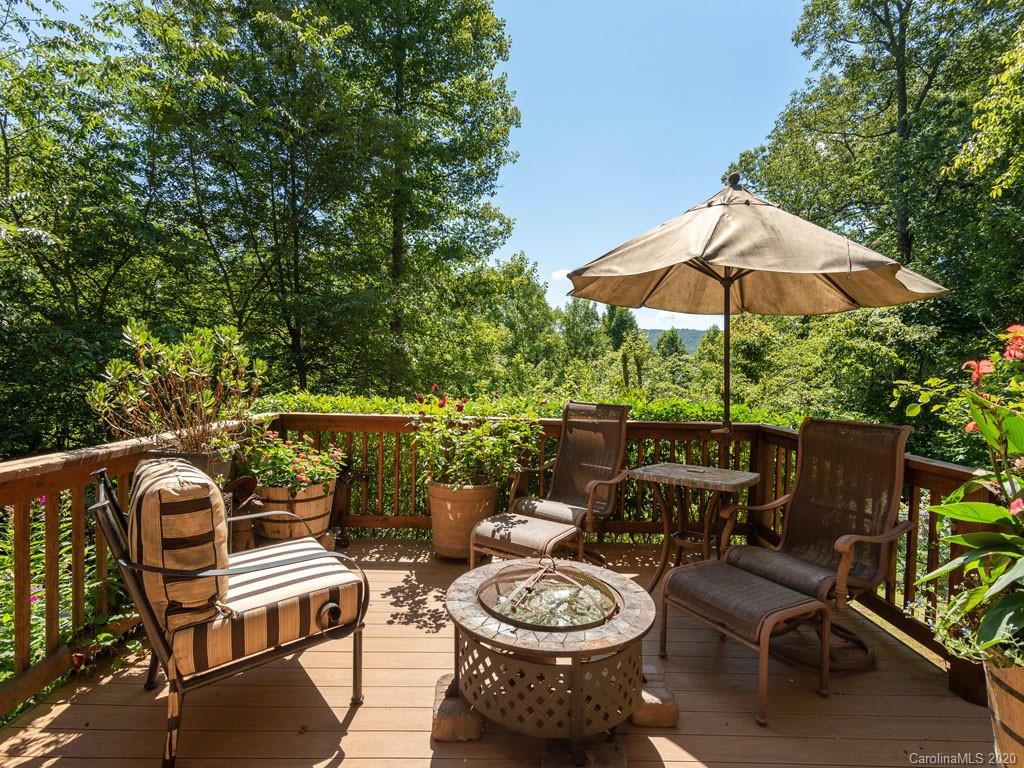 475 Indian Ridge Trail Hendersonville, NC 28739 - Photo 28 of 34 a view of a patio with furniture and a backyard