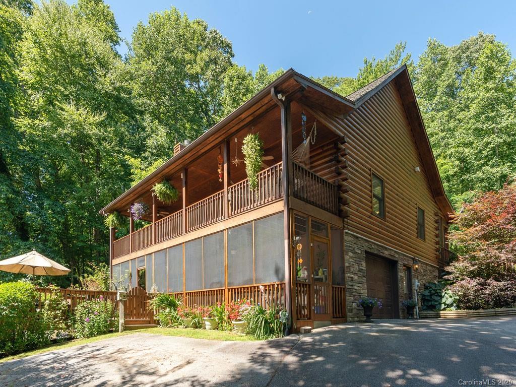 475 Indian Ridge Trail Hendersonville, NC 28739 - Photo 29 of 34 a view of a house with a yard