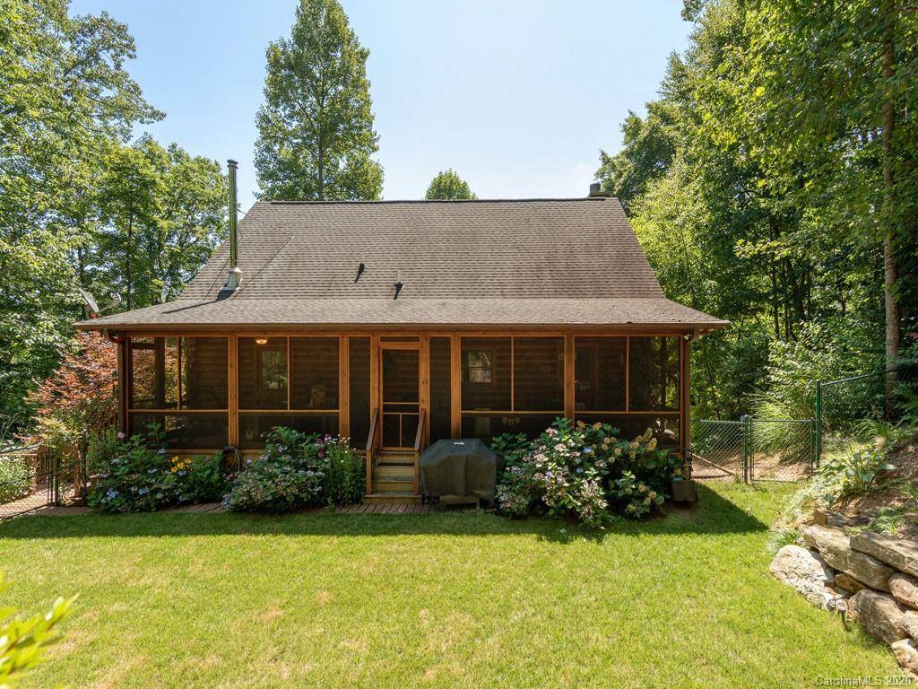 475 Indian Ridge Trail Hendersonville, NC 28739 - Photo 33 of 34 a view of a house with garden and yard