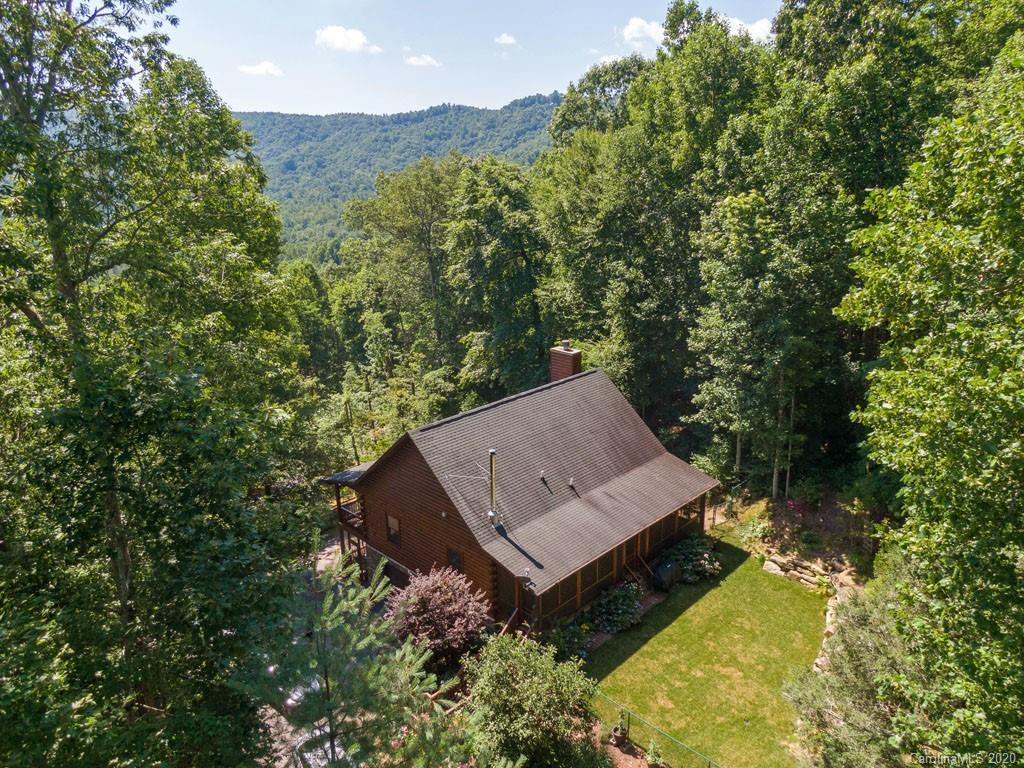 475 Indian Ridge Trail Hendersonville, NC 28739 - Photo 34 of 34 a view of a house with a yard and a large tree