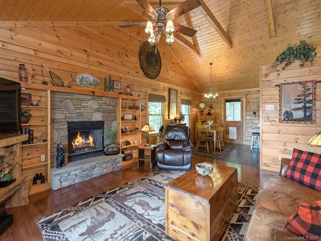 475 Indian Ridge Trail Hendersonville, NC 28739 - Photo 10 of 34 a living room with furniture and a fireplace