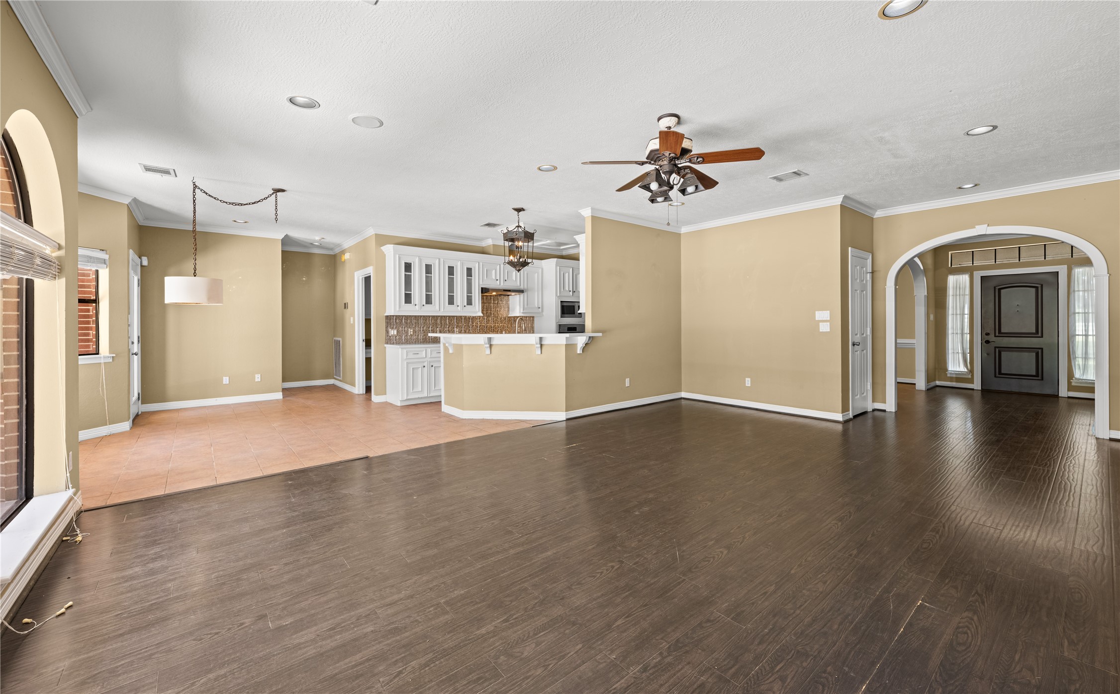 20240 Cypress Rosehill Road Tomball, TX 77377 - Photo 20 of 26 a view of a kitchen with a sink a refrigerator a kitchen a sink and a wooden floor
