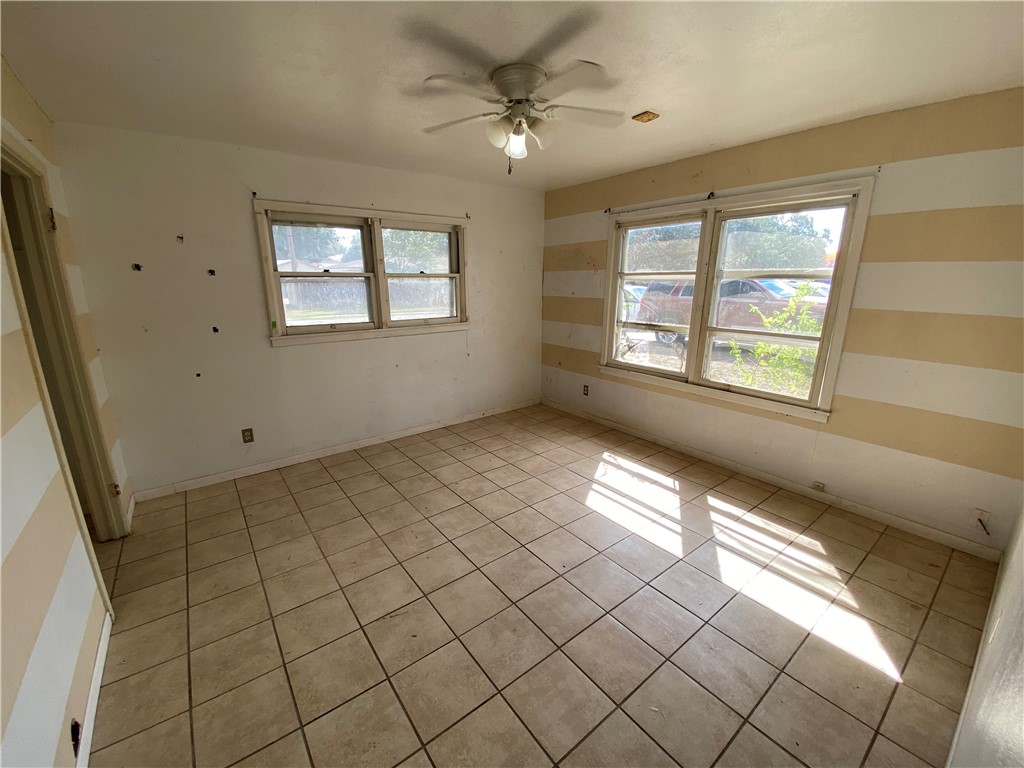 1211 Highland Avenue Alice, TX 78332 - Photo 18 of 28 a view of an empty room and window