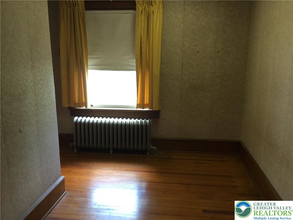 1105 Main Street Slatington, PA 18080 - Photo 18 of 31 Hardwood floors and a large window provide a simple, cozy space ready for personalization.