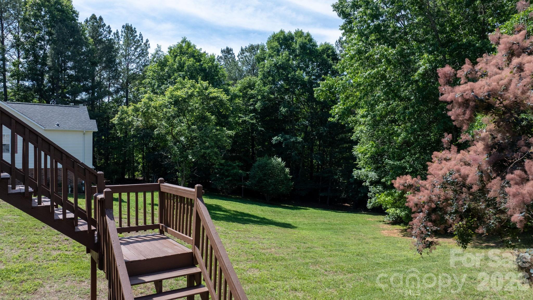4967 Addison Lane Hickory, NC 28601 - Photo 27 of 43 a view of a wooden deck with a bench