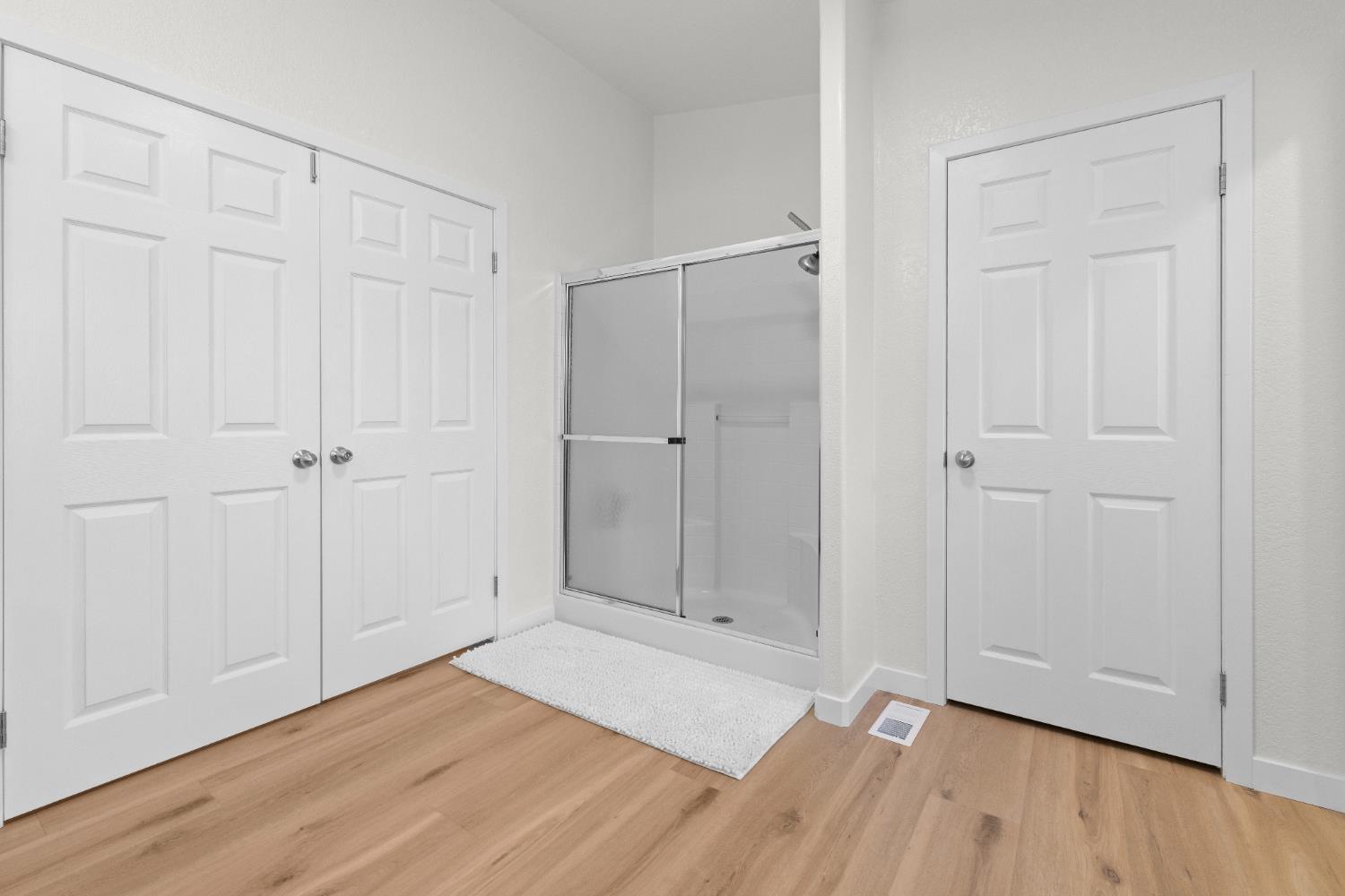 10665 Harris Road Auburn, CA 95603 - Photo 21 of 34 a view of an empty room with wooden floor