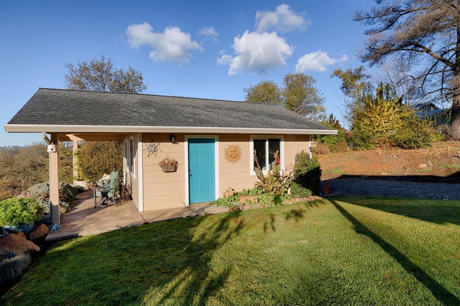 10665 Harris Road Auburn, CA 95603 - Photo 22 of 34 a front view of a house with garden