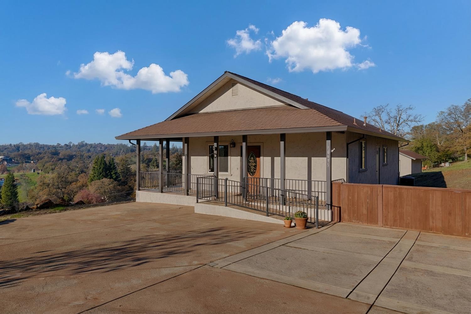 10665 Harris Road Auburn, CA 95603 - Photo 23 of 34 a view of a house with backyard and porch