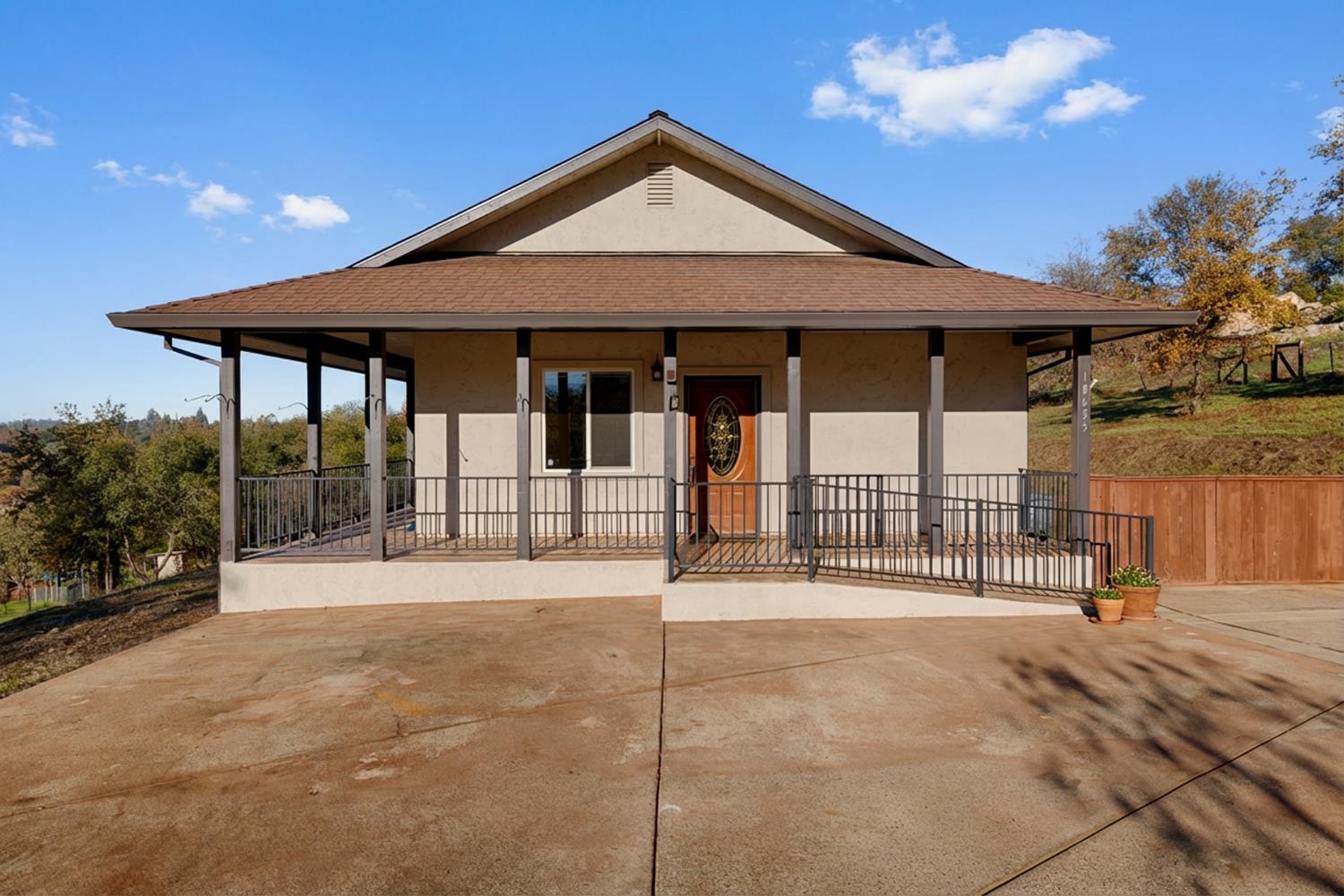 10665 Harris Road Auburn, CA 95603 - Photo 24 of 34 a front view of a house with a porch