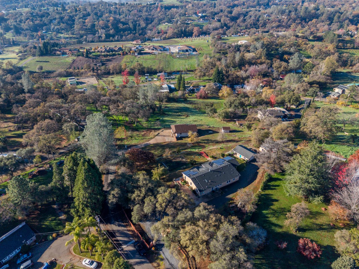10665 Harris Road Auburn, CA 95603 - Photo 32 of 34 an aerial view of a house with yard swimming pool and outdoor seating