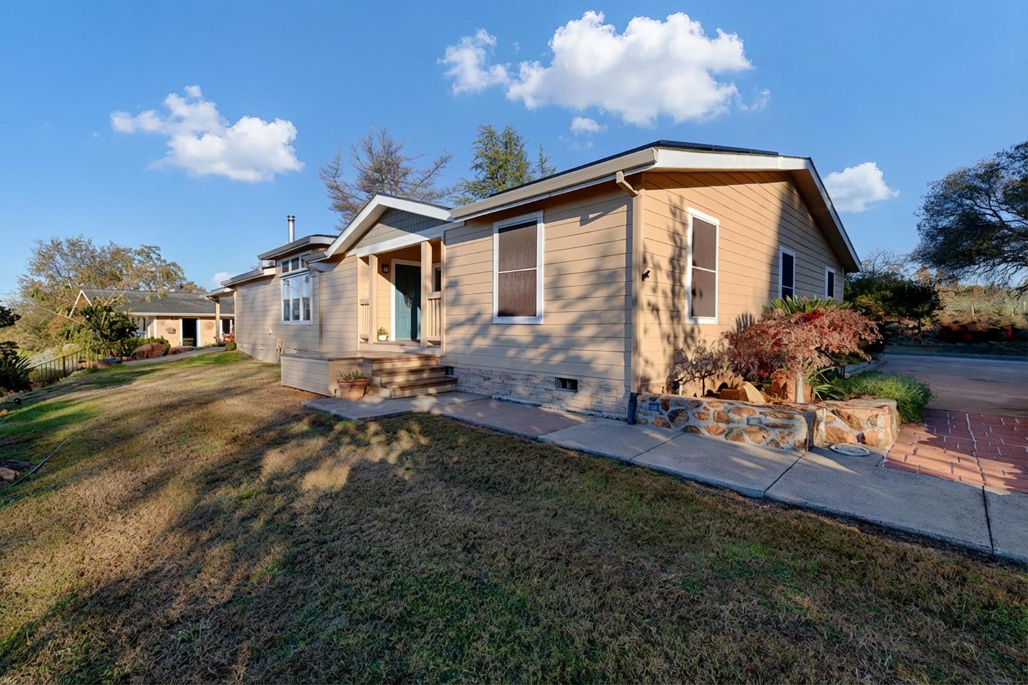 10665 Harris Road Auburn, CA 95603 - Photo 6 of 34 a backyard of a house with table and chairs