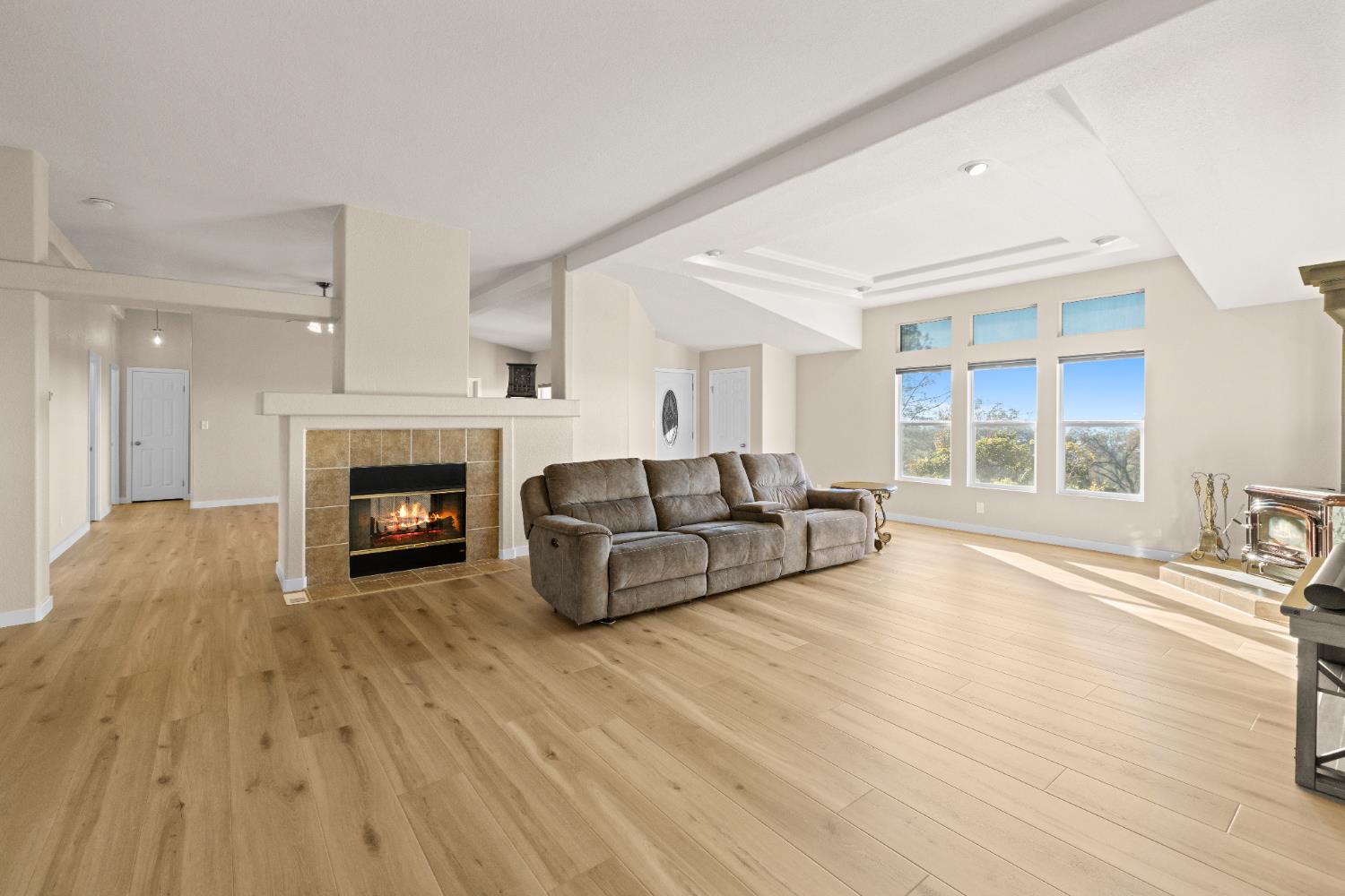 10665 Harris Road Auburn, CA 95603 - Photo 9 of 34 a living room with furniture and a fireplace