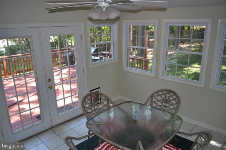 13005 Sturbridge Road Woodbridge, VA 22192 - Photo 5 of 7 Relaxing sunroom w/vaulted ceiling and tile floor
