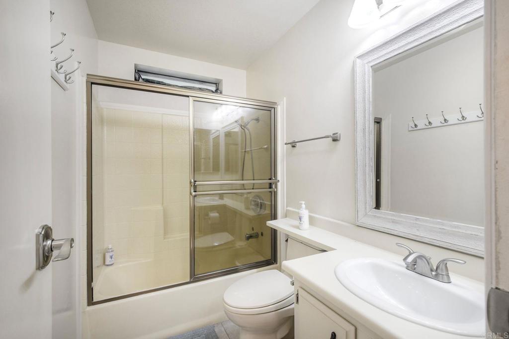 18218 Paradise Mountain Road Valley Center, CA 92082 - Photo 22 of 34 a bathroom with a sink toilet and shower
