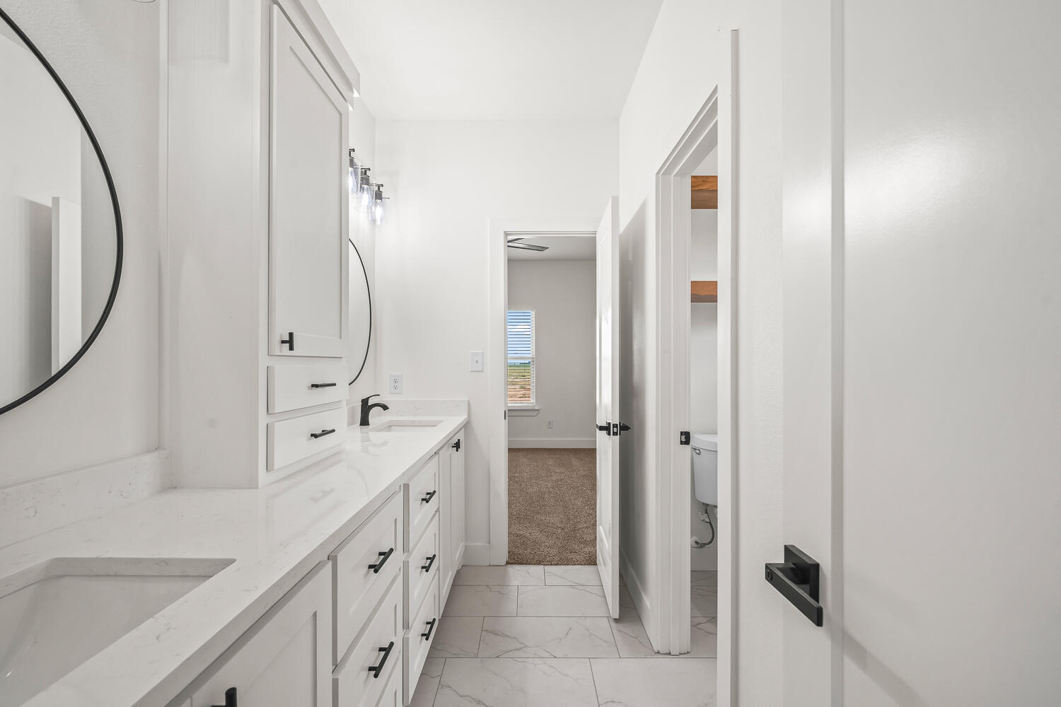 7205 East F M 41 Slaton, TX 79364 - Photo 22 of 47 a spacious bathroom with a double vanity sink and a mirror