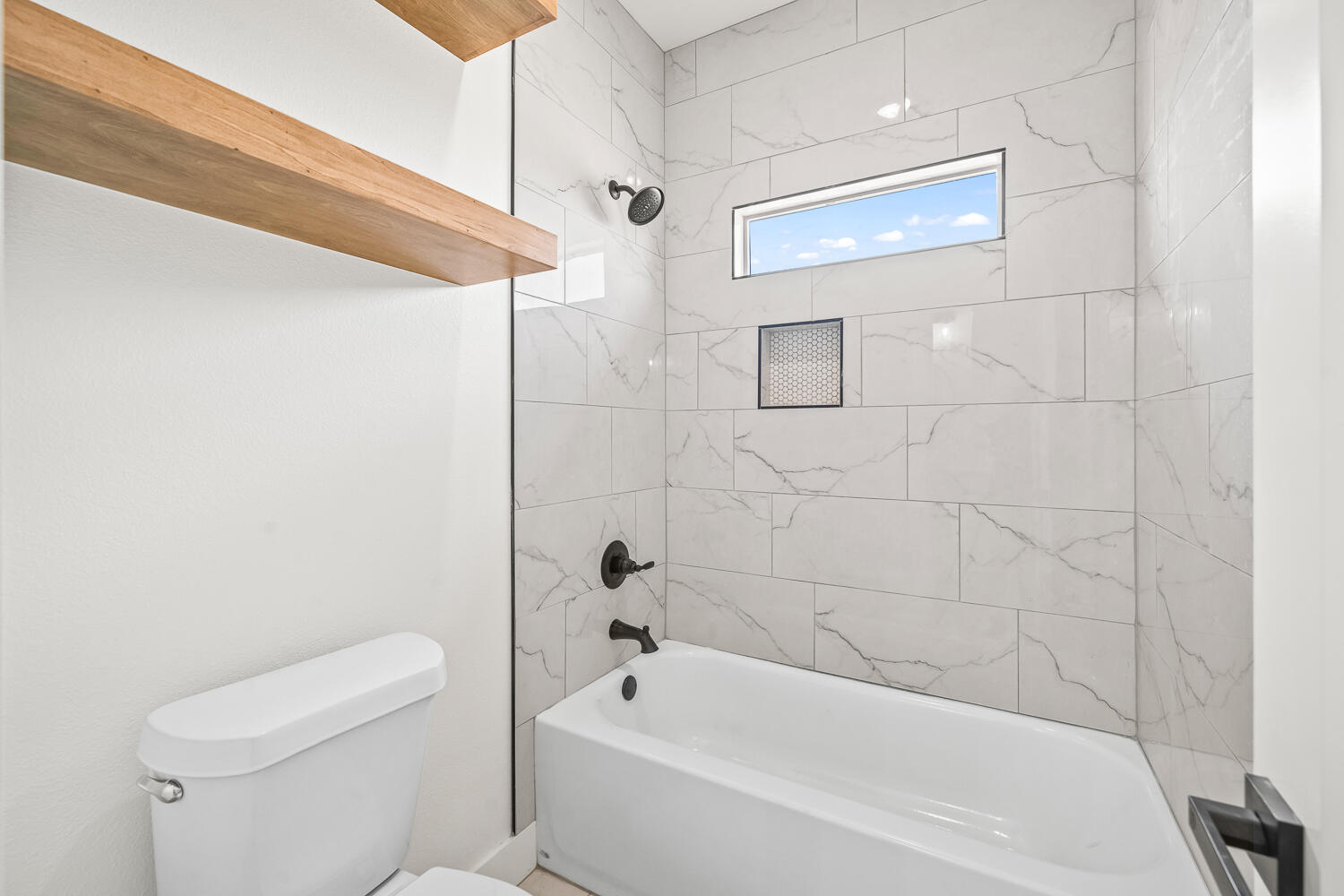 7205 East F M 41 Slaton, TX 79364 - Photo 23 of 47 a bathroom with a bathtub and a toilet