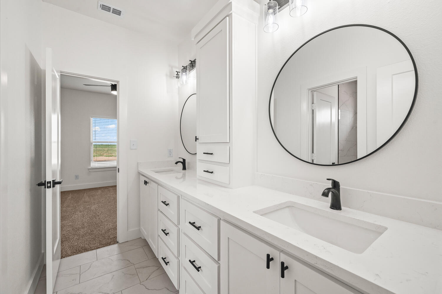 7205 East F M 41 Slaton, TX 79364 - Photo 24 of 47 a bathroom with a double vanity sink mirror and a mirror