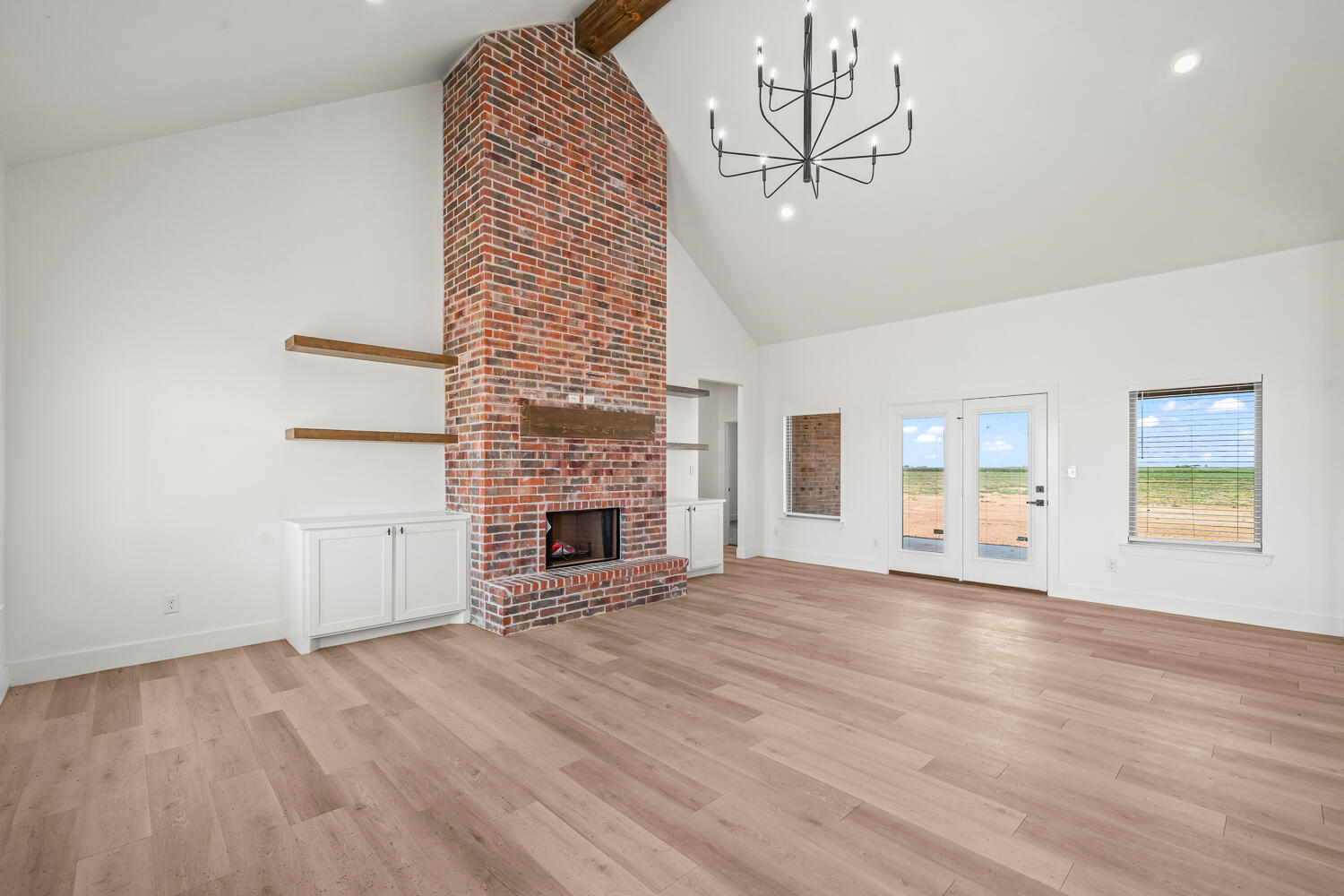 7205 East F M 41 Slaton, TX 79364 - Photo 40 of 47 a view of empty room with wooden floor and fireplace