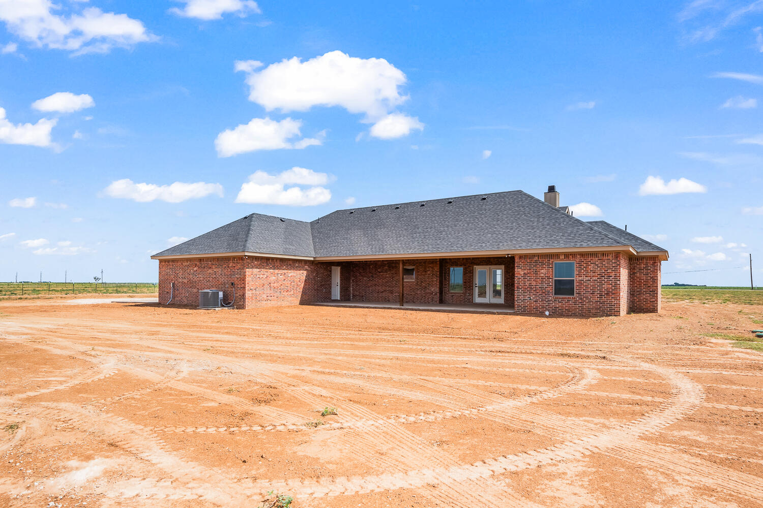 7205 East F M 41 Slaton, TX 79364 - Photo 46 of 47 a front view of a house with a yard and garage
